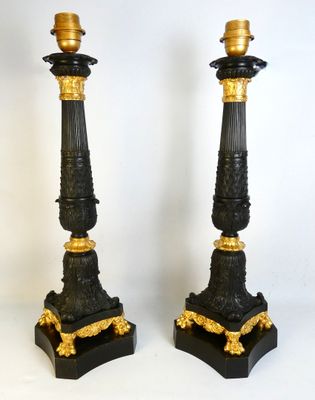 pair of antique black and gold candlesticks on marble bases