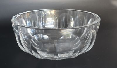 a glass bowl that is sitting on a table