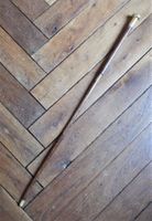 CANNE en bois teinté à pommeau en vermeil à décor de frises …