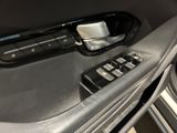 a close up of a car door handle with a remote control