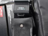 a couple of cameras sitting on top of a black bag