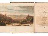 un livre ouvert avec l'image d'un château en arrière-plan