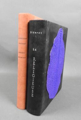 the two books are next to each other on a gray surface