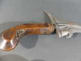 a knife that is on display on a table