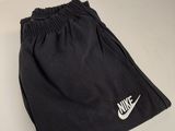 black nike shorts with white nike logo on the side