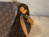 louis vuittoupe bag on the floor