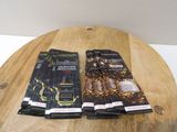 three packets of chocolate sitting on top of a wooden table