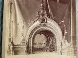 an old photo of a picture of a building with a clock on it