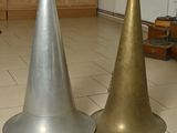 two cones that are sitting on the floor in the room