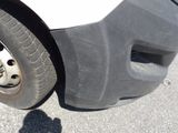a close up of a tire on a white truck