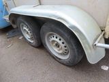 an image of a trailer with a flat tire