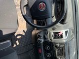 a steering wheel and dashboard of a small car