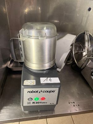 a silver blender sitting on top of a metal counter