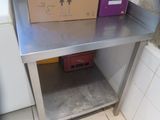 a metal table with a box on top of it