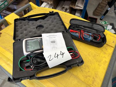 two electronic devices in a case sitting on a table