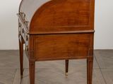 an image of a small wooden desk with a glass top