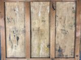 painting of a wooden paneled wall with paint stains and stains on it