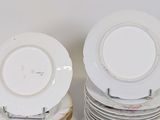 many plates stacked on top of each other on a table
