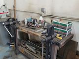 a workbench with tools on it in a garage