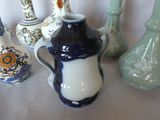 many vases that are sitting on a table