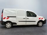 the white van is parked in a room with a gray floor
