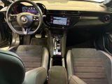 the interior of a car with a steering wheel, dashboard, and dashboard controls