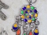 several different types of jewelry are laying out on a table