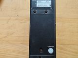 an image of a remote control on a wooden table