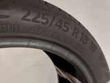 a close up of a tire on a white surface with a sticker on it