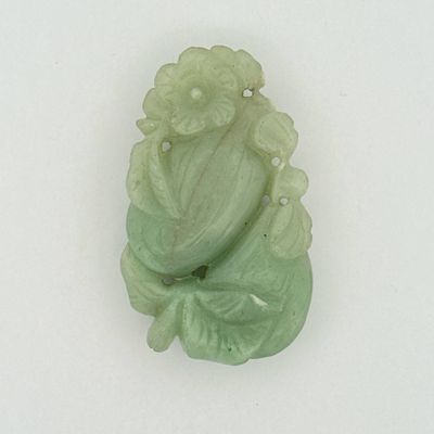 a picture of a green jade carving of a buddha