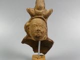 an image of a sculpture of a bear on a wooden stand