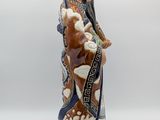 a figurine of a man holding a baseball bat