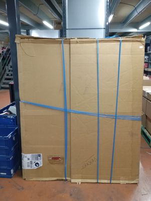 a large cardboard box sitting on the floor in a warehouse