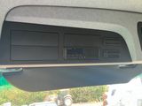 a picture of a car dashboard with a clock and radio