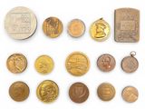 an image of a collection of old and new coins on a white surface