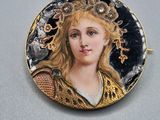 portrait of a woman with a crown of flowers in a gold and enamel broochle