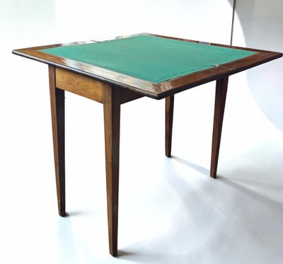a small table with a green cloth on top of it