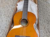 a guitar that is in a box on the floor
