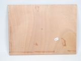 an image of a piece of wood with a sticker on it