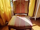a chair that is sitting in front of a window