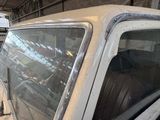 a white truck that is parked in a garage