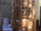 several rolls of paper are stacked on top of each other in a warehouse