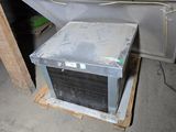 an old air conditioner sitting in a garage