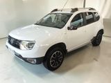 the white dacia is parked in a large room with white walls