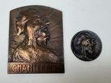 a metal plaque with a picture of a man on it