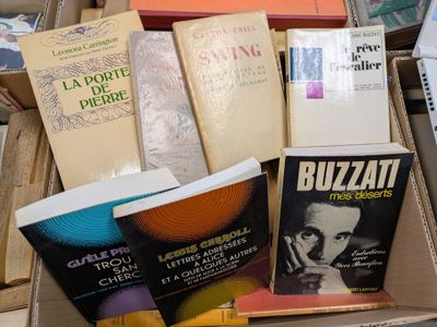 boxes of books are stacked on top of each other on a table