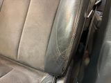 a close up of a car seat with a dirty seat cover