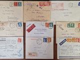 many different types of letters and envelopes on the table