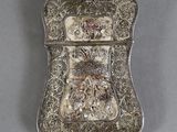 a silver box with a picture of a man and a woman on it