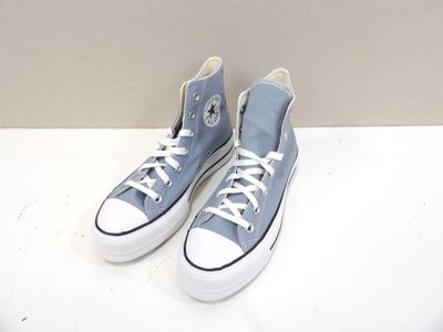 blue converse sneakers with white laces are on a white surface